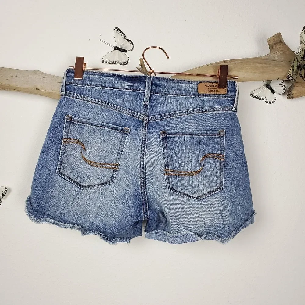 Levi's high rise distressed denim shorts